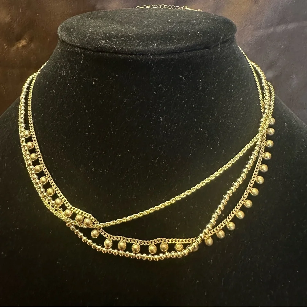 The sis kiss gold tone triple layered signed necklace with original box